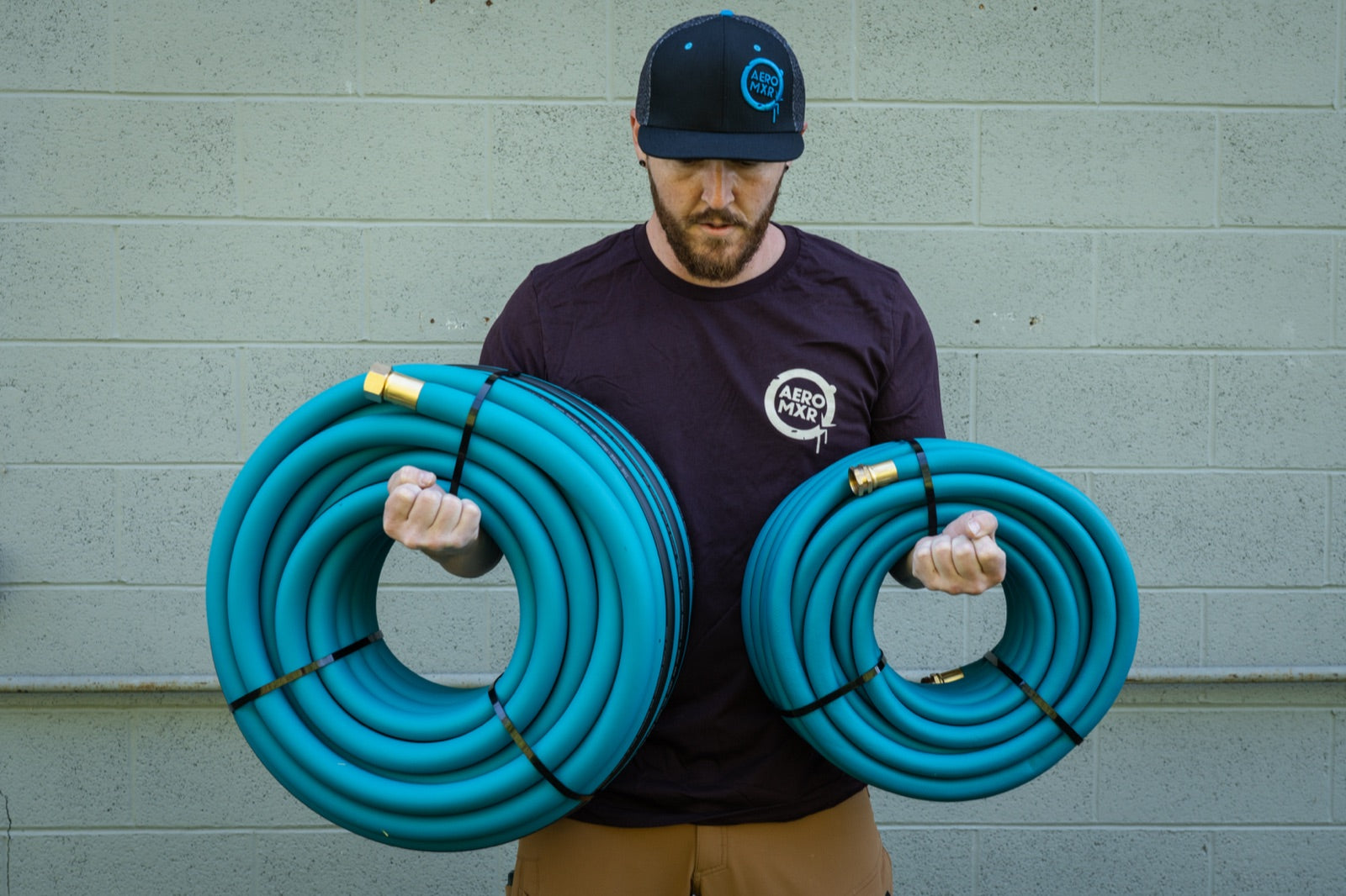 Two full coils of THE HOSE 3/4-inch, brass ends out