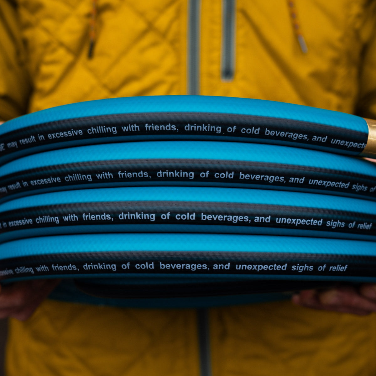 lead: hose held in a yellow jacket
